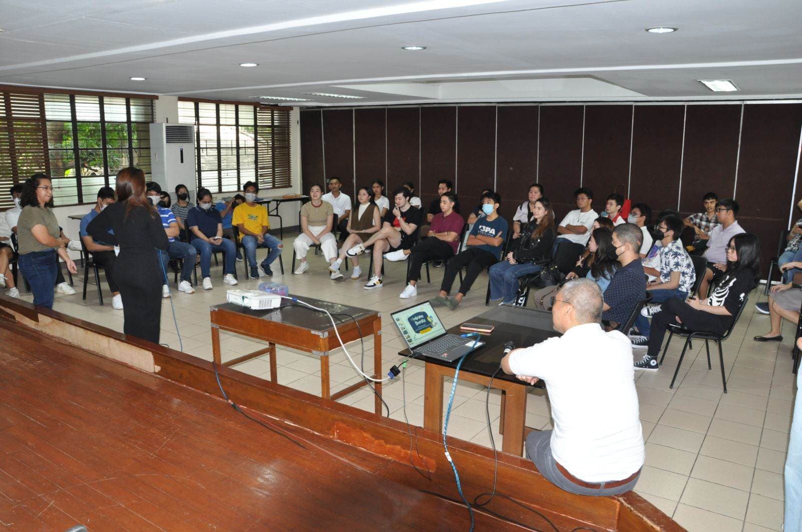 Corporate volunteers teaching digital skills to core members